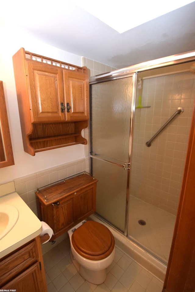131 Cherryl Ln Unit 4, Algonac, MI 48001 - bathroom featuring tile patterned floors, a stall shower, vanity, and tile walls