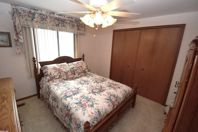 131 Cherryl Ln Unit 4, Algonac, MI 48001 - bedroom with light carpet, a closet, and ceiling fan