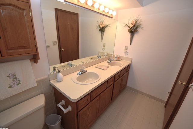 131 Cherryl Ln Unit 4, Algonac, MI 48001 - bathroom featuring double vanity and tile patterned flooring