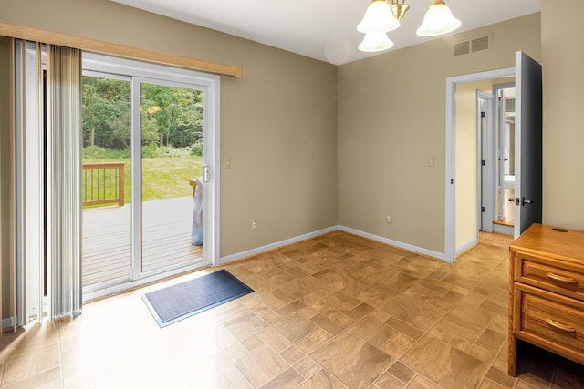 769 Snowmass Dr, Rochester Hills, MI 48309 - doorway to outside featuring a chandelier and baseboards