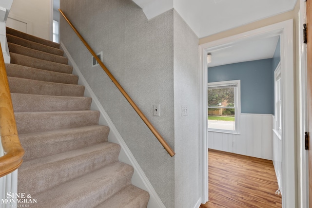 1284 Brys Dr, Grosse Pointe Woods, MI 48236 - stairway featuring wood finished floors and a wainscoted wall