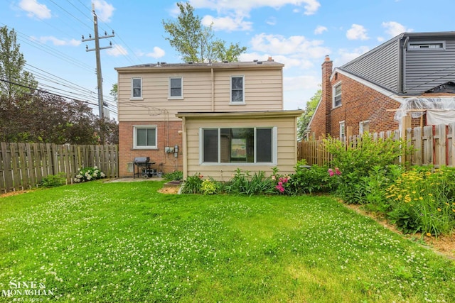 1284 Brys Dr, Grosse Pointe Woods, MI 48236 - back of property with a fenced backyard and brick siding