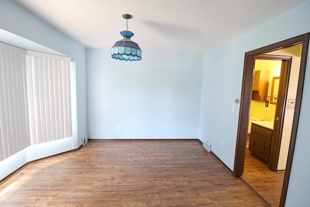48501 E Ranch Dr, Chesterfield Twp, MI 48051 - spare room featuring wood finished floors and baseboards