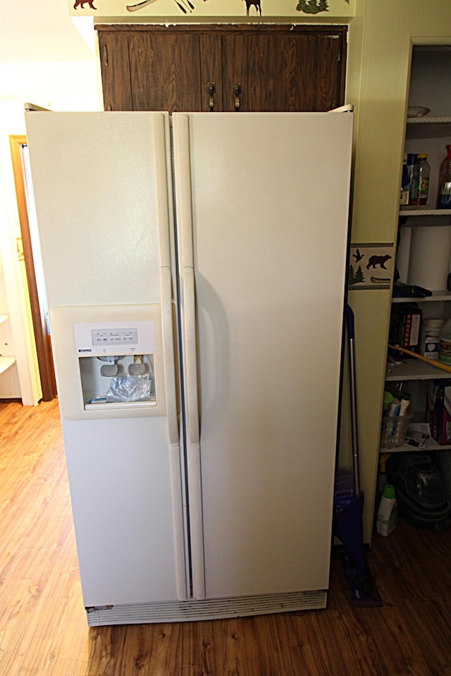 48501 E Ranch Dr, Chesterfield Twp, MI 48051 - detailed view of white fridge with ice dispenser and wood finished floors