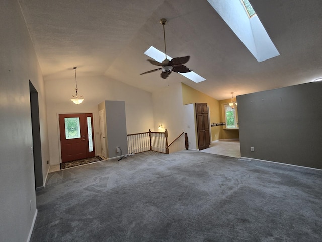 10505 N Athey Ave, Harrison, MI 48625 - unfurnished living room with a skylight, lofted ceiling, carpet flooring, and a ceiling fan