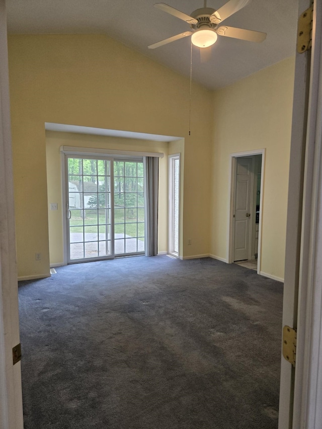 10505 N Athey Ave, Harrison, MI 48625 - spare room featuring dark colored carpet, a ceiling fan, and high vaulted ceiling