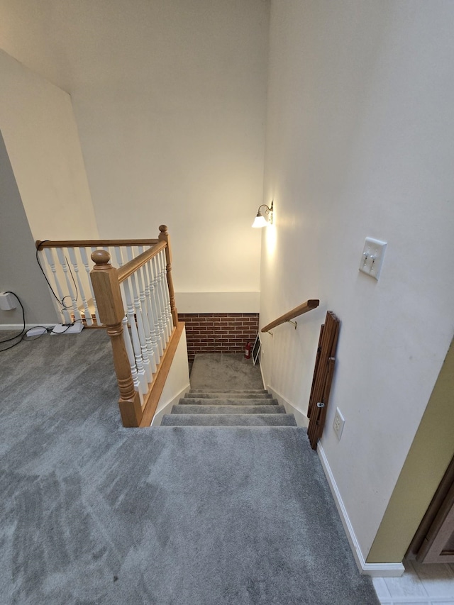 10505 N Athey Ave, Harrison, MI 48625 - stairway featuring carpet floors