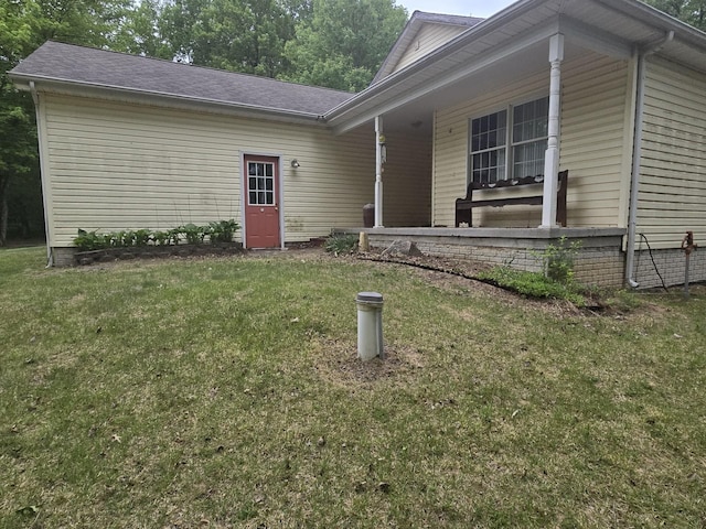 10505 N Athey Ave, Harrison, MI 48625 - view of exterior entry featuring a lawn