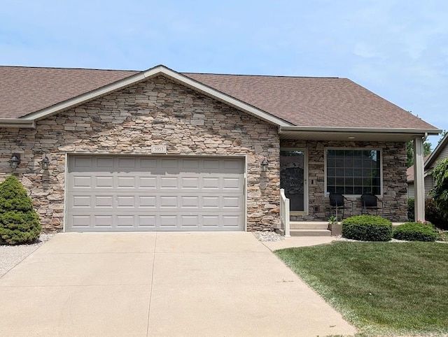 5953 Qwinn Ct, Bay City, MI 48706 - view of front of house featuring stone siding, a shingled roof, concrete driveway, an attached garage, and a front lawn
