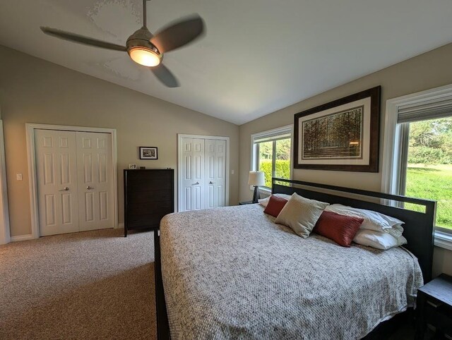 5953 Qwinn Ct, Bay City, MI 48706 - bedroom featuring multiple closets, lofted ceiling, ceiling fan, and carpet flooring