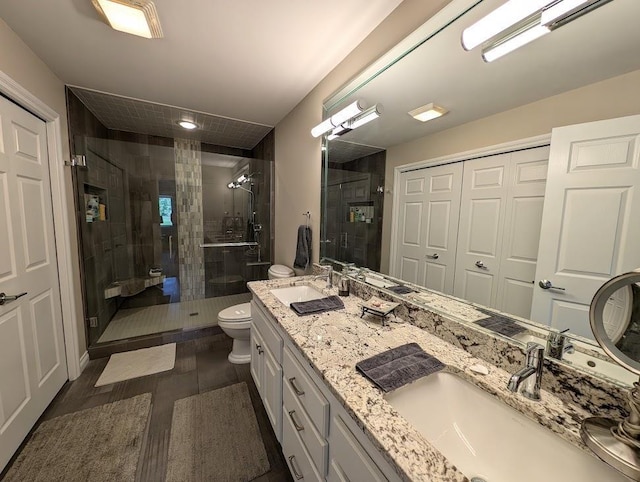5953 Qwinn Ct, Bay City, MI 48706 - full bathroom featuring a stall shower, double vanity, and wood finished floors