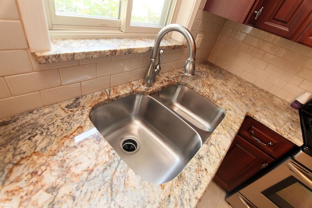31717 Tecla St, Warren, MI 48088 - kitchen view of tasteful backsplash and light stone counters