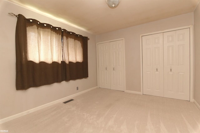 31717 Tecla St, Warren, MI 48088 - unfurnished bedroom featuring carpet flooring and two closets