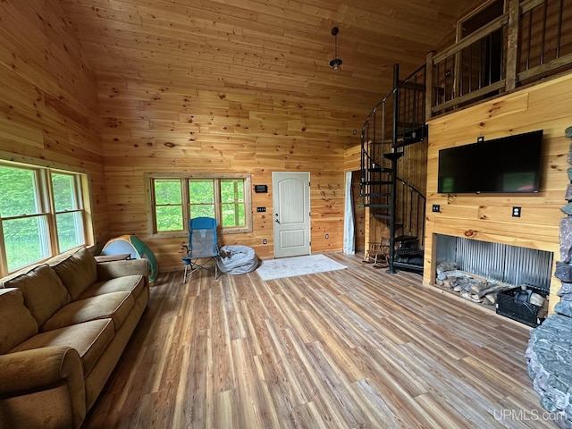 23505 Craig Lake Rd, Michigamme, MI 49861 - living room with wood finished floors, stairs, wood walls, high vaulted ceiling, and wood ceiling