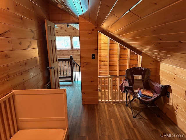23505 Craig Lake Rd, Michigamme, MI 49861 - sitting room with lofted ceiling, wooden walls, wooden ceiling, hardwood / wood-style floors, and an upstairs landing