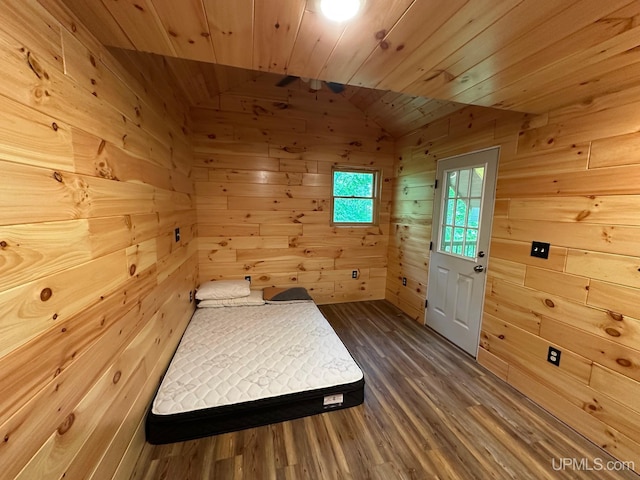 23505 Craig Lake Rd, Michigamme, MI 49861 - unfurnished bedroom with wood ceiling, dark wood finished floors, wooden walls, and vaulted ceiling
