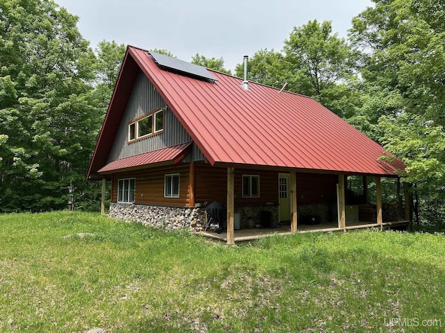 23505 Craig Lake Rd, Michigamme, MI 49861 - rear view of property with a standing seam roof, a metal roof, and a patio