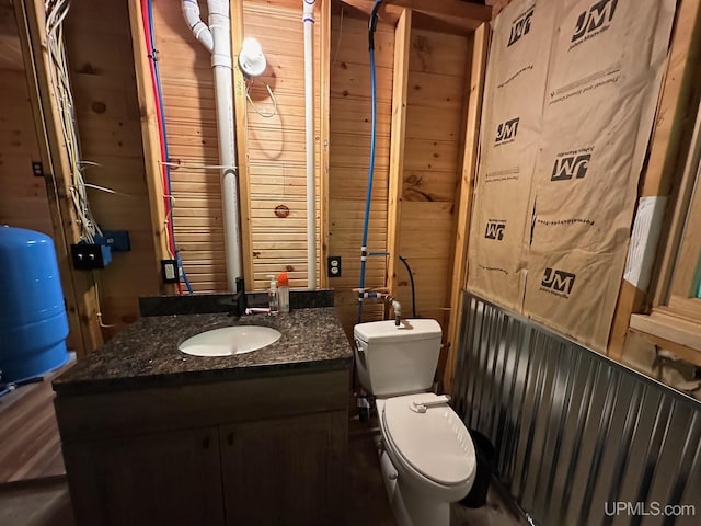 23505 Craig Lake Rd, Michigamme, MI 49861 - bathroom featuring vanity and wooden walls
