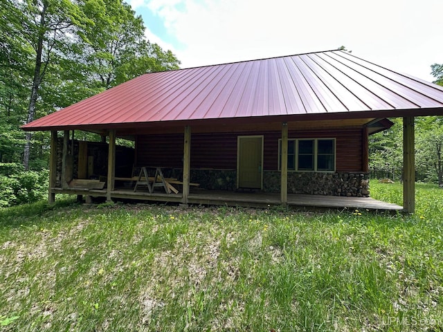 23505 Craig Lake Rd, Michigamme, MI 49861 - view of front of property with a standing seam roof, a metal roof, and stone siding