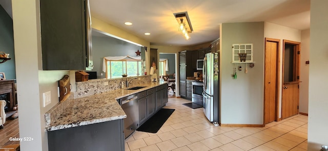 2793 Carina Dr, North Branch, MI 48461 - kitchen featuring stainless steel appliances, light tile patterned floors, recessed lighting, and light stone countertops