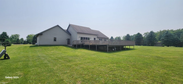 2793 Carina Dr, North Branch, MI 48461 - view of green lawn featuring a deck