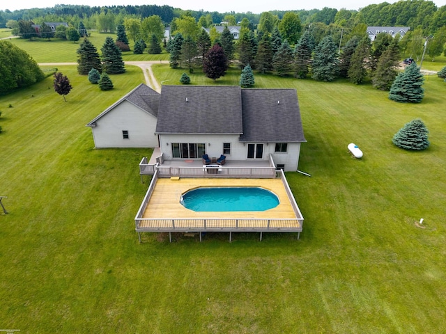 2793 Carina Dr, North Branch, MI 48461 - outdoor pool with a lawn and a wooden deck