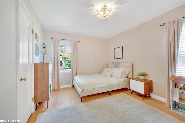 2080 Beaufait Dr, Grosse Pointe Woods, MI 48236 - bedroom with light wood finished floors and baseboards