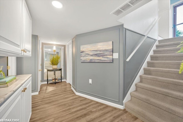 2080 Beaufait Dr, Grosse Pointe Woods, MI 48236 - entryway with light wood-type flooring, stairway, and recessed lighting