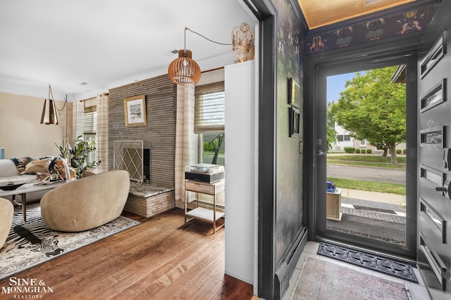 1389 Bedford Rd, Grosse Pointe Park, MI 48230 - entrance foyer with hardwood / wood-style flooring and a fireplace