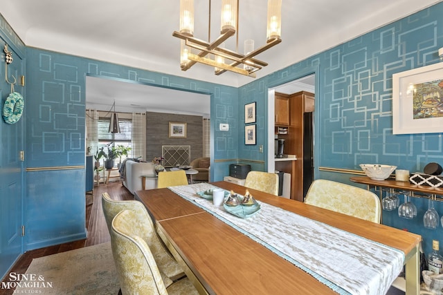 1389 Bedford Rd, Grosse Pointe Park, MI 48230 - dining area featuring a chandelier, wood finished floors, and wallpapered walls