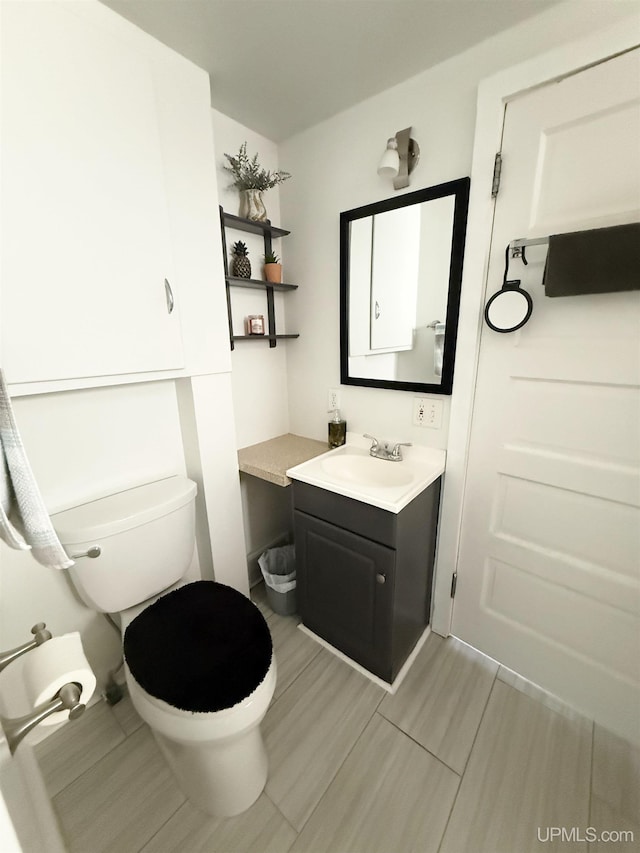401 White St, Hancock, MI 49930 - bathroom featuring vanity and toilet