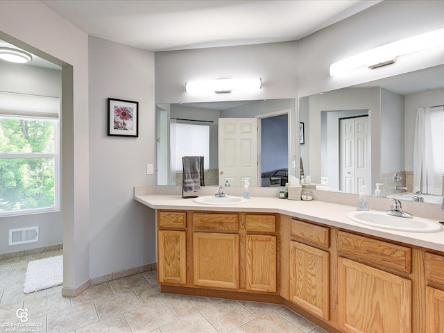 30569 Austin Ct, Chesterfield, MI 48051 - ensuite bathroom with double vanity and baseboards