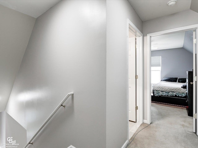 30569 Austin Ct, Chesterfield, MI 48051 - hallway featuring light colored carpet, an upstairs landing, and vaulted ceiling