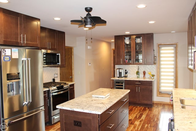 43980 Boulder Rd, Clinton Township, MI 48038 - kitchen featuring stainless steel appliances, ceiling fan, wood finished floors, recessed lighting, and backsplash