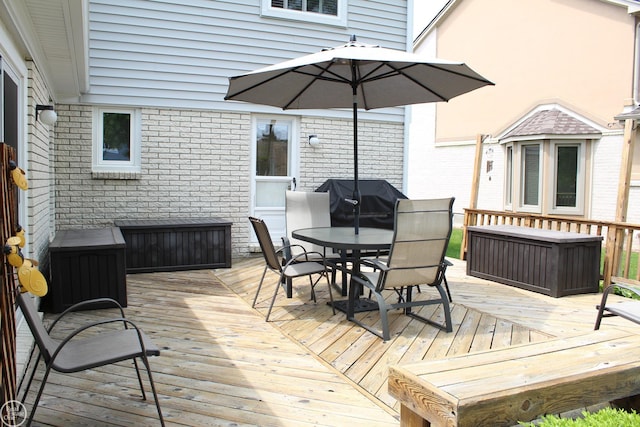 43980 Boulder Rd, Clinton Township, MI 48038 - wooden deck featuring outdoor dining area