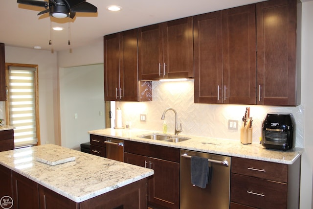43980 Boulder Rd, Clinton Township, MI 48038 - kitchen with dishwasher, ceiling fan, backsplash, light stone counters, and a kitchen island