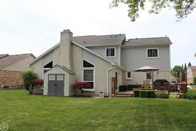 43980 Boulder Rd, Clinton Township, MI 48038 - rear view of house featuring a storage shed, a lawn, a chimney, a deck, and brick siding