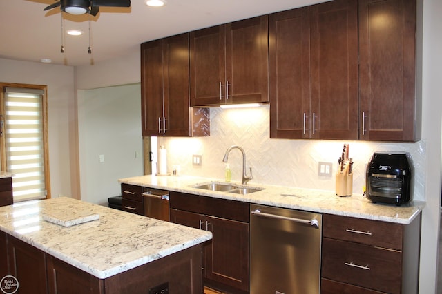 43980 Boulder Rd, Clinton Township, MI 48038 - kitchen with stainless steel dishwasher, decorative backsplash, a ceiling fan, light stone counters, and recessed lighting