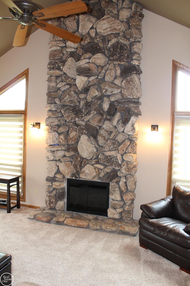 43980 Boulder Rd, Clinton Township, MI 48038 - carpeted living room with a stone fireplace, ceiling fan, and lofted ceiling