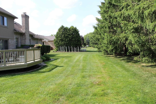 54640 Burlington Dr, Shelby Twp, MI 48315 - view of grassy yard with a wooden deck