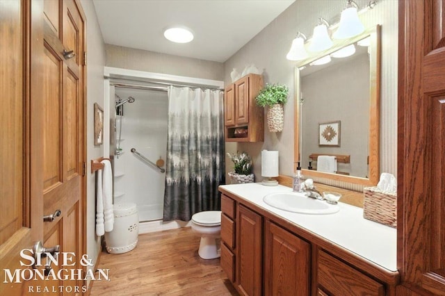 7119 Simons St, Lexington, MI 48450 - bathroom with vanity, curtained shower, and wood finished floors