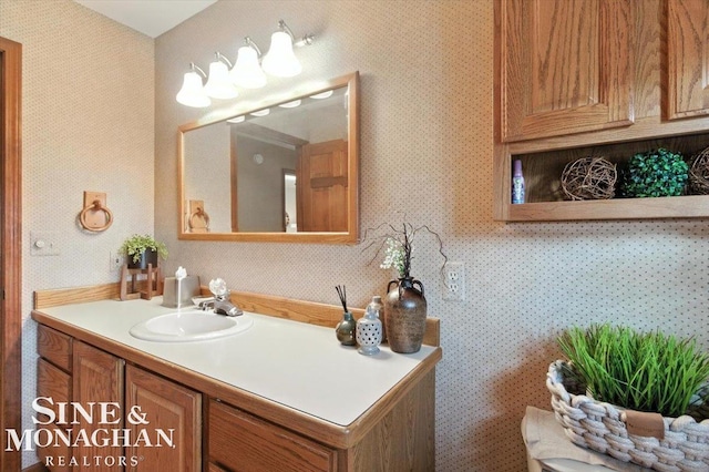 7119 Simons St, Lexington, MI 48450 - bathroom featuring vanity and wallpapered walls