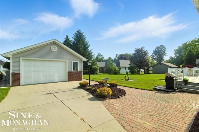 7119 Simons St, Lexington, MI 48450 - exterior space with brick siding, driveway, a lawn, a detached garage, and an outbuilding