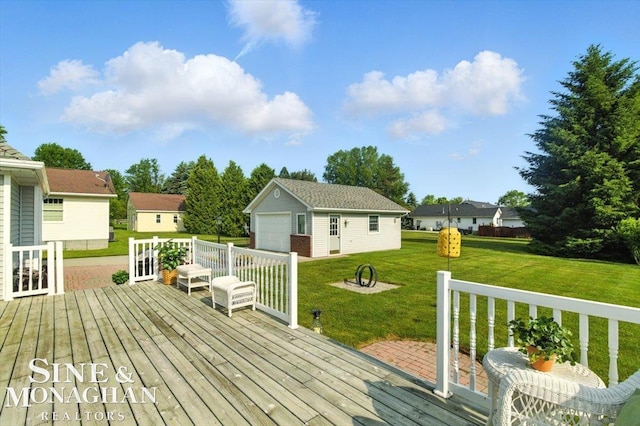 7119 Simons St, Lexington, MI 48450 - wooden terrace featuring an outbuilding, a garage, and a lawn