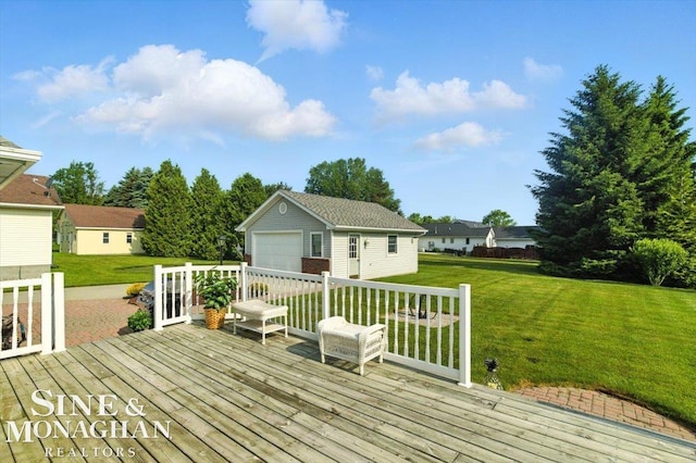 7119 Simons St, Lexington, MI 48450 - deck with an outbuilding, a garage, and a lawn