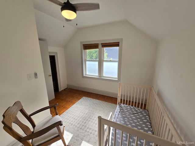 816 W Bluff St, Marquette, MI 49855 - bedroom with lofted ceiling, a ceiling fan, and wood finished floors