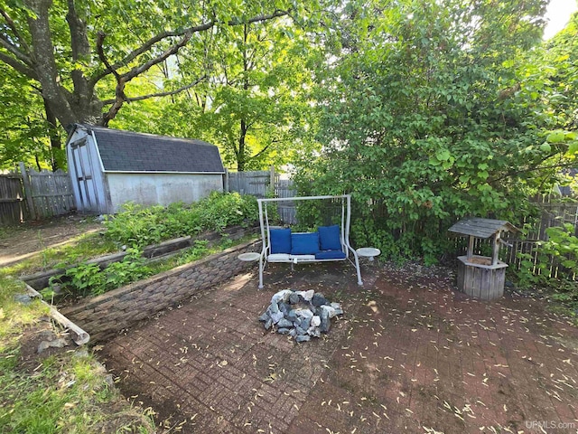 816 W Bluff St, Marquette, MI 49855 - fenced backyard with a storage unit and a patio
