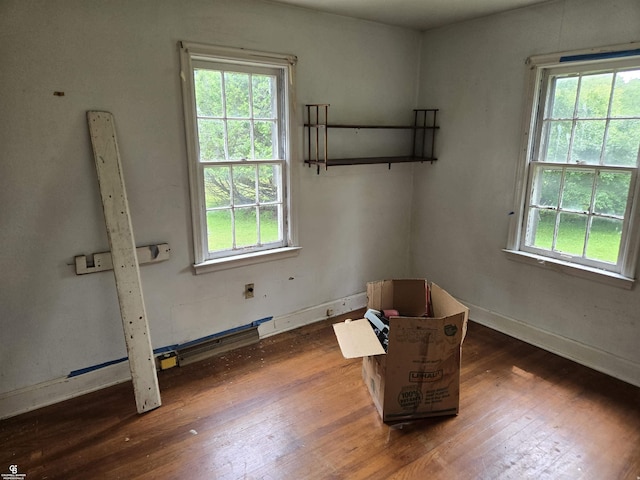 1675 Bauman Rd, Columbus, MI 48063 - unfurnished room featuring healthy amount of natural light and hardwood / wood-style floors