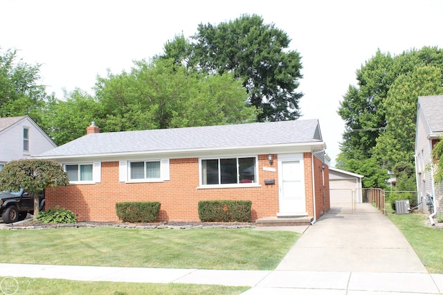 28117 Shock St, Saint Clair Shores, MI 48081 - ranch-style home featuring brick siding, a front yard, an outdoor structure, and roof with shingles