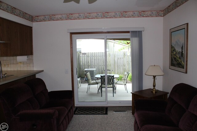 28117 Shock St, Saint Clair Shores, MI 48081 - living area featuring carpet flooring and a ceiling fan